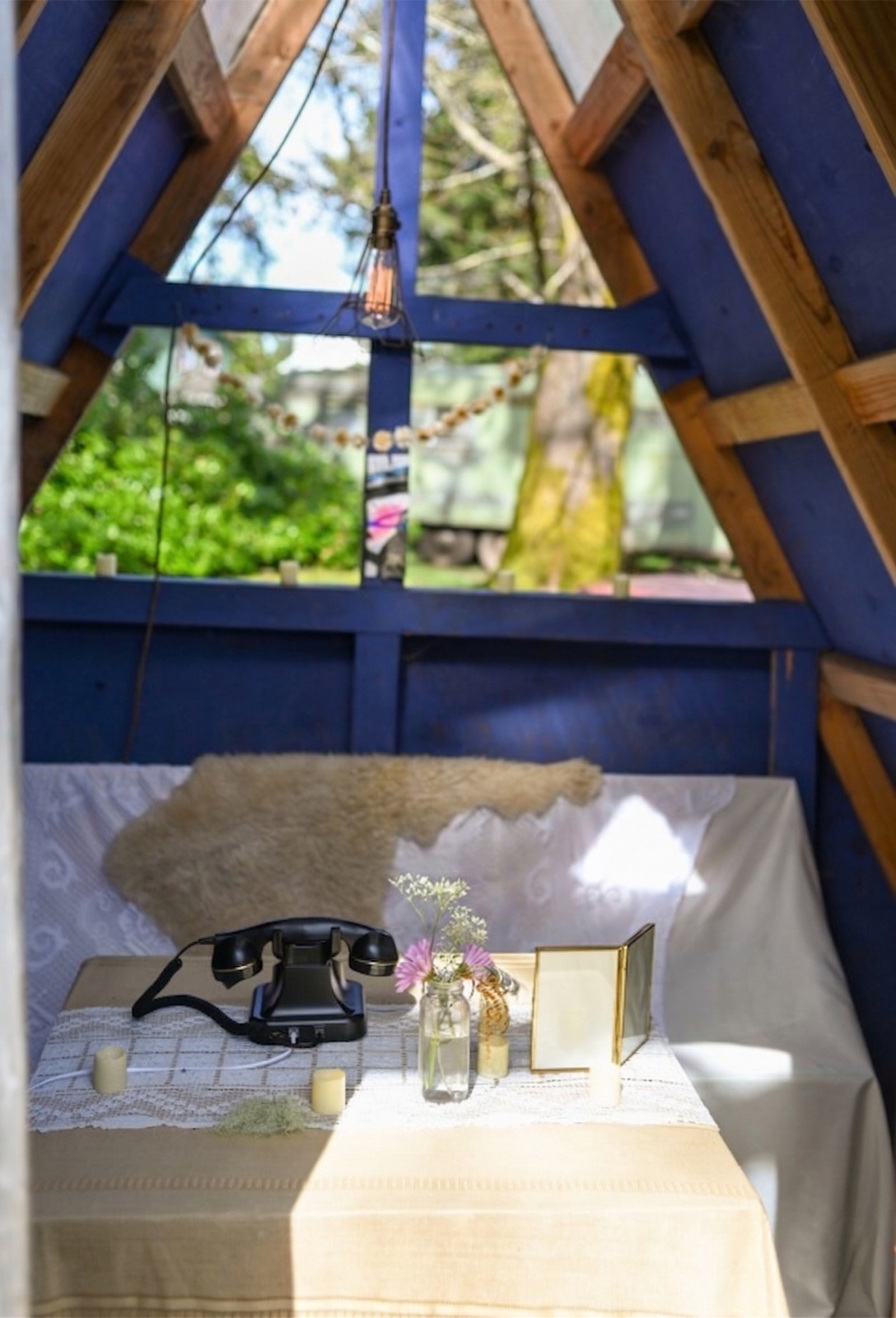Rotary phone in blue A-frame cabin
