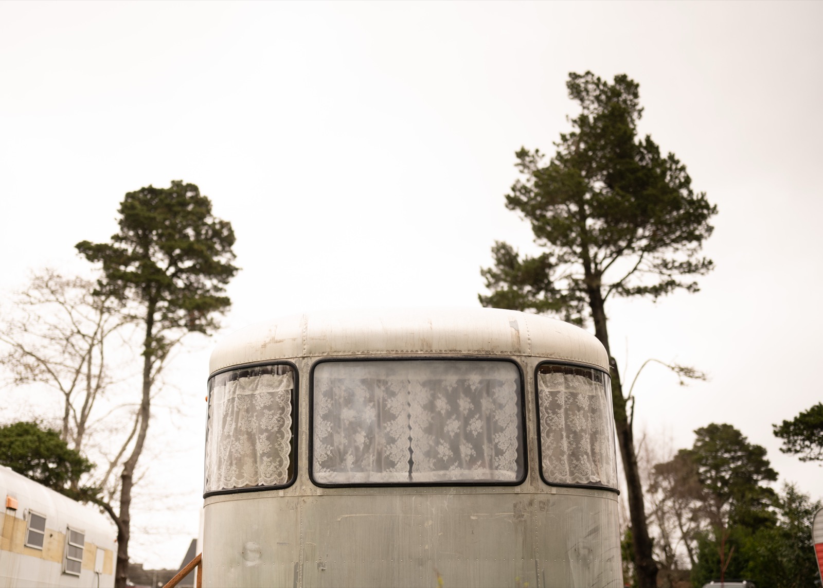 Airstream trailer with lace curtains