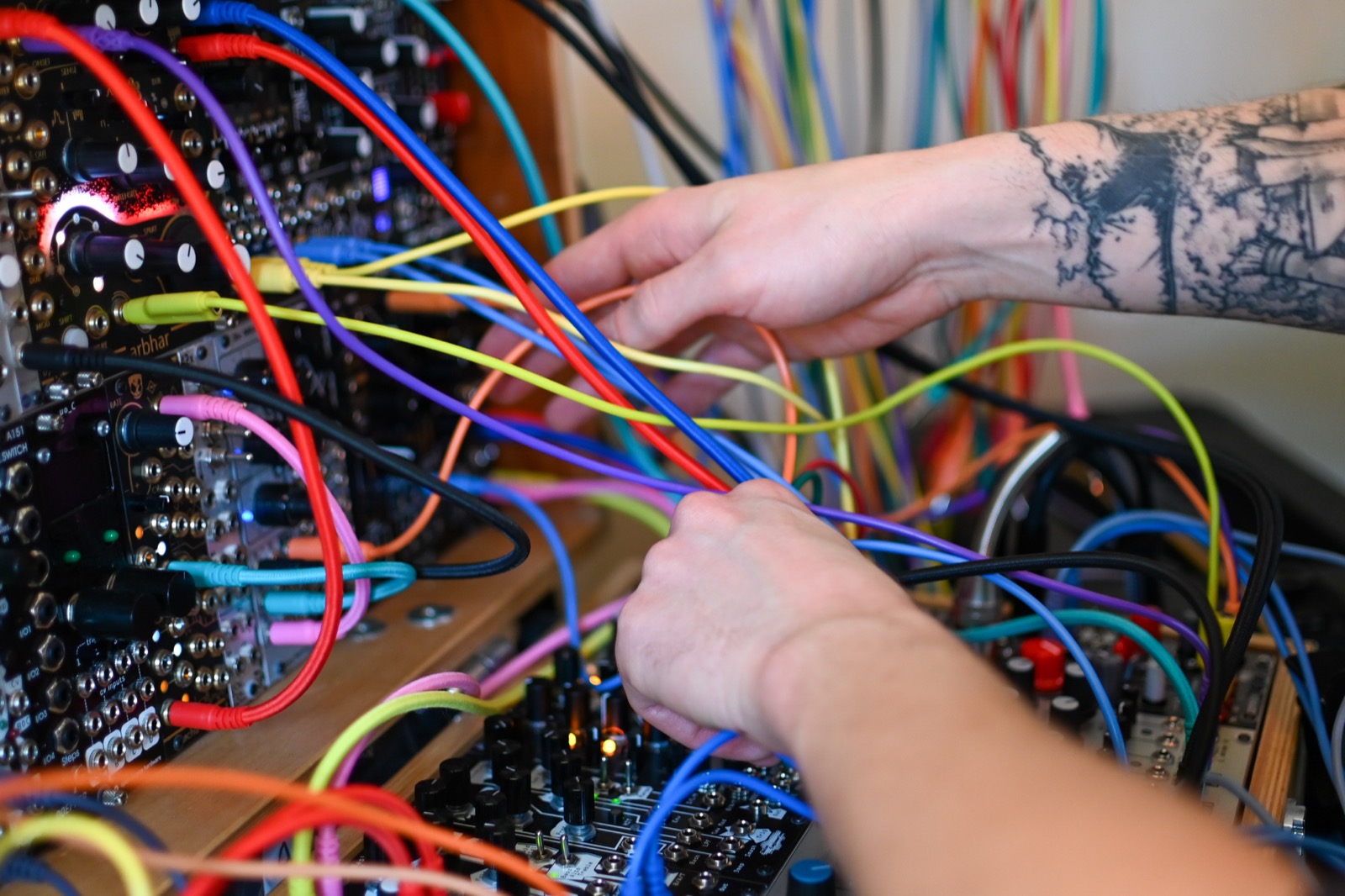 Close-up of patching modular synth cables